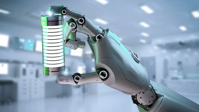 Humanoid robot hand holding battery indicating the robot's battery management system capabilities.