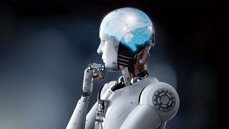 Humanoid robot in thinking position with illuminated brain illustration signifying robot's system compute capability.